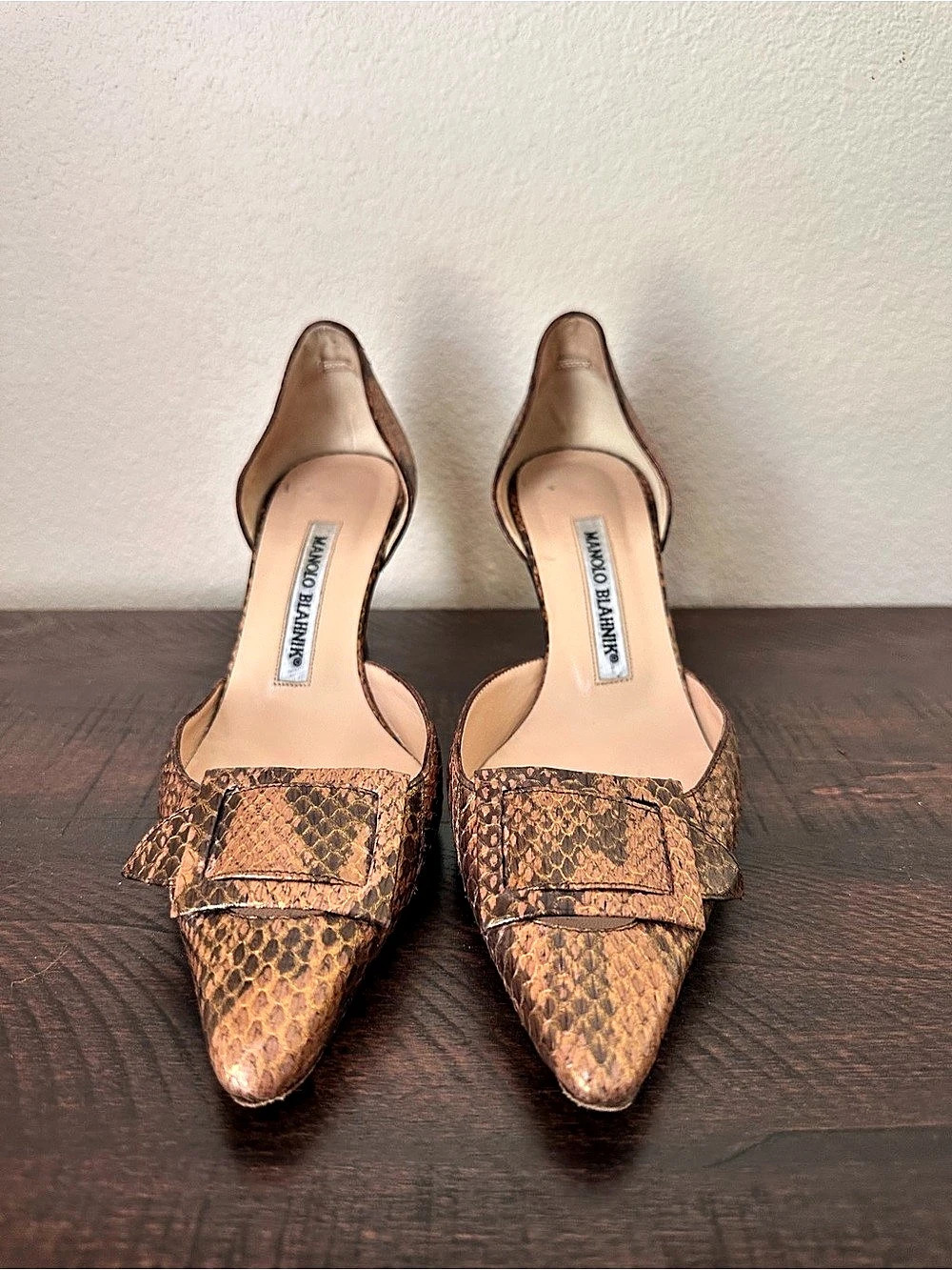 Vintage Manolo Blahnik metallic tan snakeskin D’Orsay heels.
